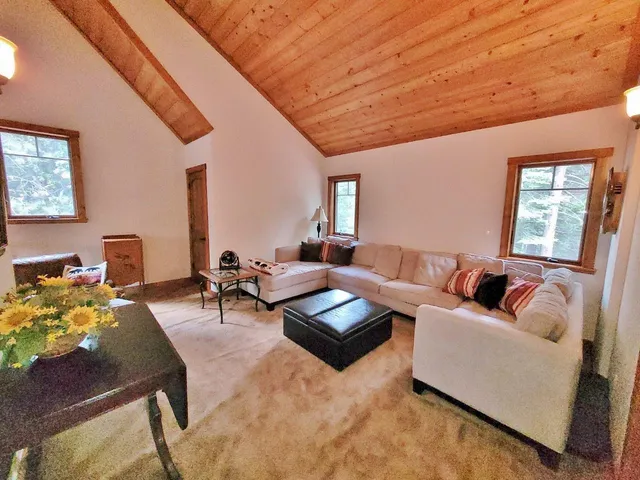 a living room with furniture and a couch