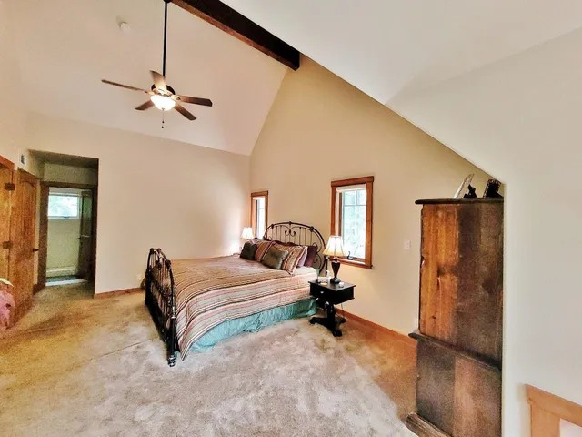 a bedroom with a bed and a dresser