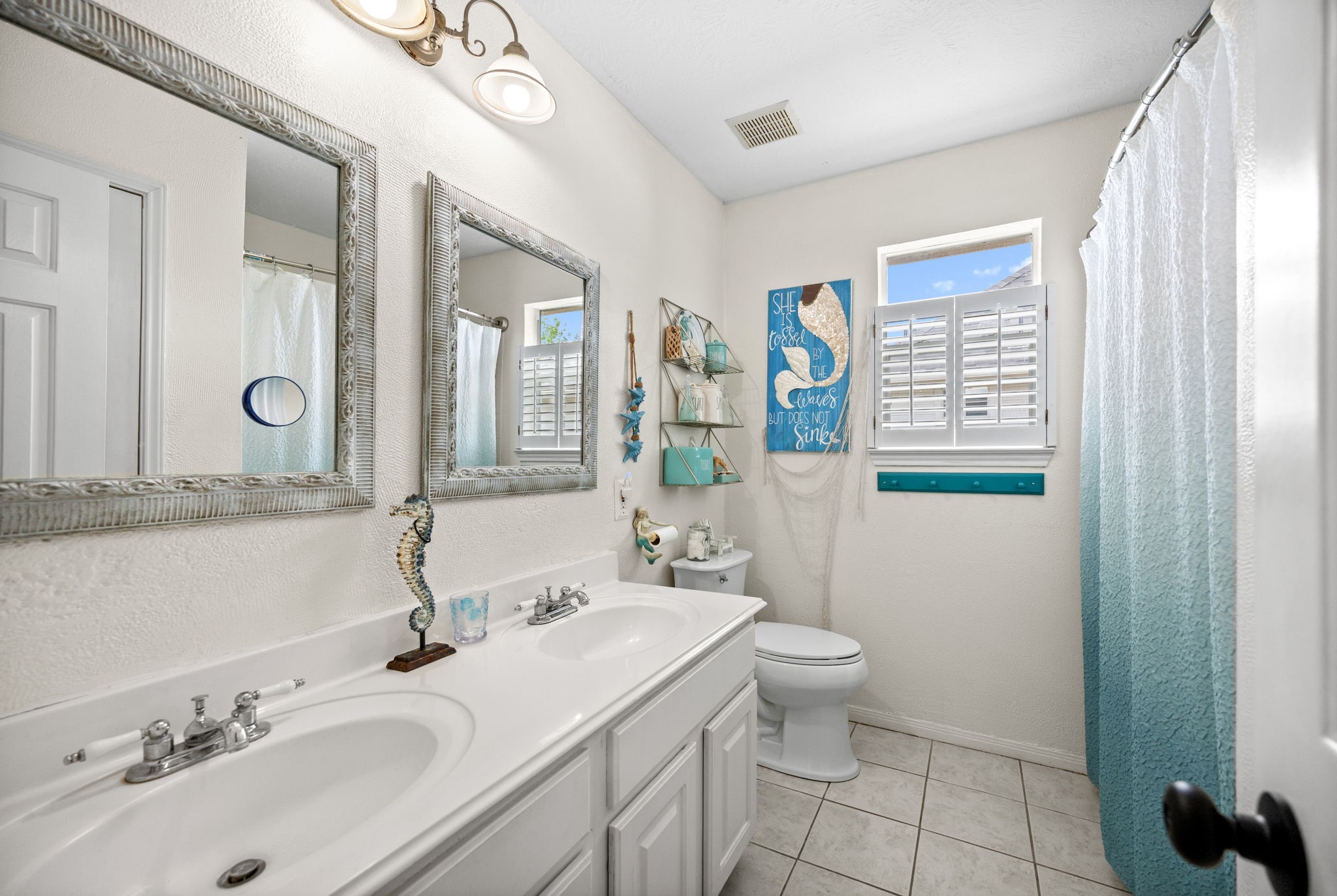 814 Legend Spring Drive Katy, TX 77494 - Photo 22 of 30 Full bath #2 is upstairs and is equipped with dual sinks, upgraded mirrors and a tub/shower combo.