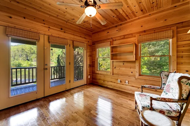 a view of an entryway with wooden floor