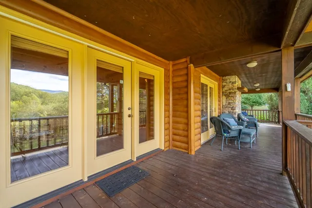 a view of two chairs in the balcony
