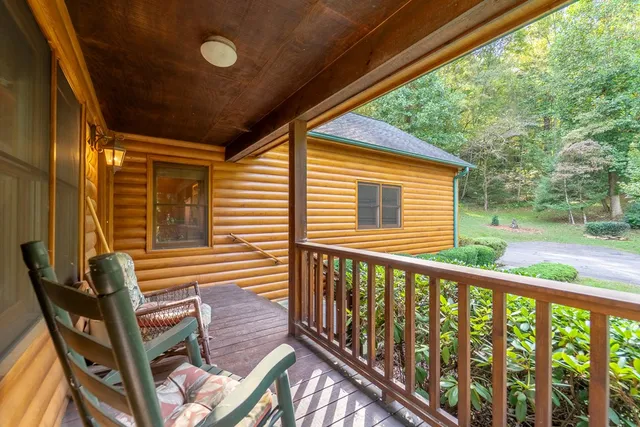 a view of a two chairs in the balcony