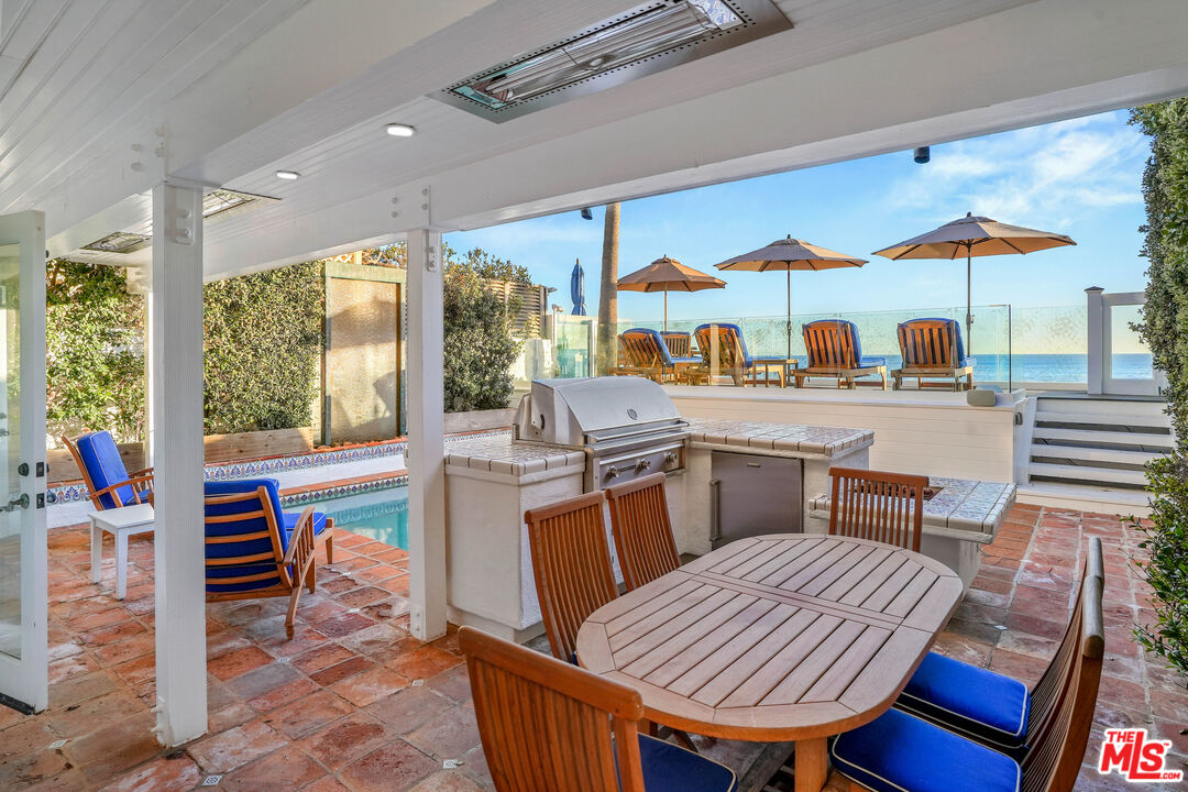 23422 Malibu Colony Road, Unit 98 Malibu, CA 90265 - Photo 12 of 53 a outdoor dining space with furniture and outdoor view