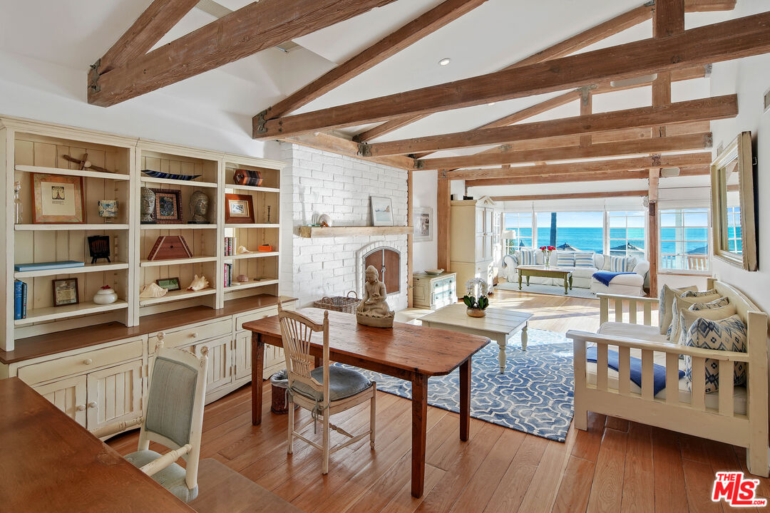 23422 Malibu Colony Road, Unit 98 Malibu, CA 90265 - Photo 17 of 53 a workspace with furniture and wooden floor