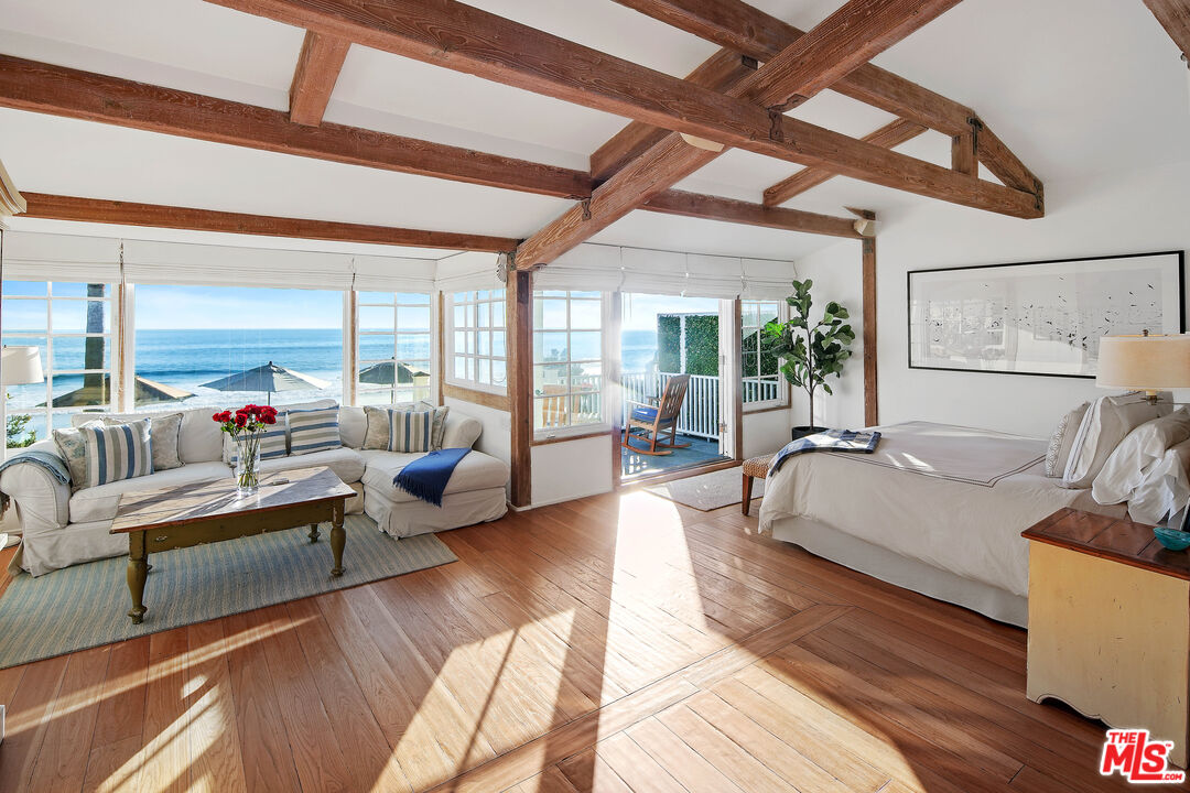 23422 Malibu Colony Road, Unit 98 Malibu, CA 90265 - Photo 19 of 53 a living room with furniture and a large window