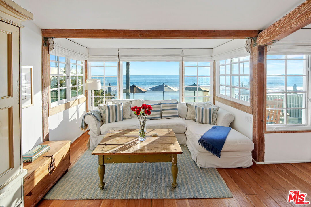 23422 Malibu Colony Road, Unit 98 Malibu, CA 90265 - Photo 20 of 53 a living room with furniture and a large window