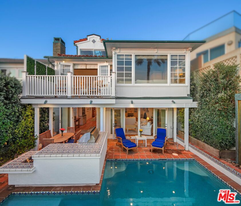 23422 Malibu Colony Road, Unit 98 Malibu, CA 90265 - Photo 2 of 53 a view of a house with pool and sitting area
