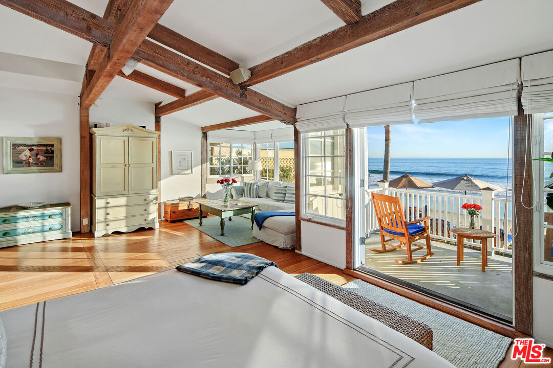 23422 Malibu Colony Road, Unit 98 Malibu, CA 90265 - Photo 22 of 53 a living room with furniture and a table