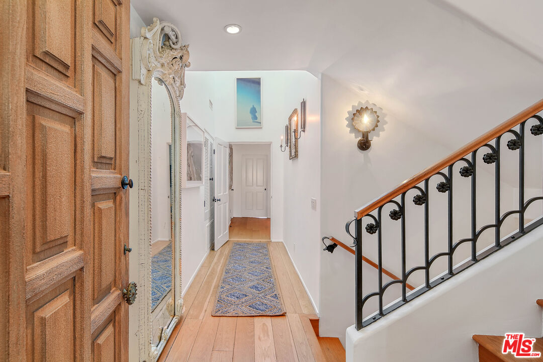23422 Malibu Colony Road, Unit 98 Malibu, CA 90265 - Photo 27 of 53 a view of an entryway with wooden floor and stairs