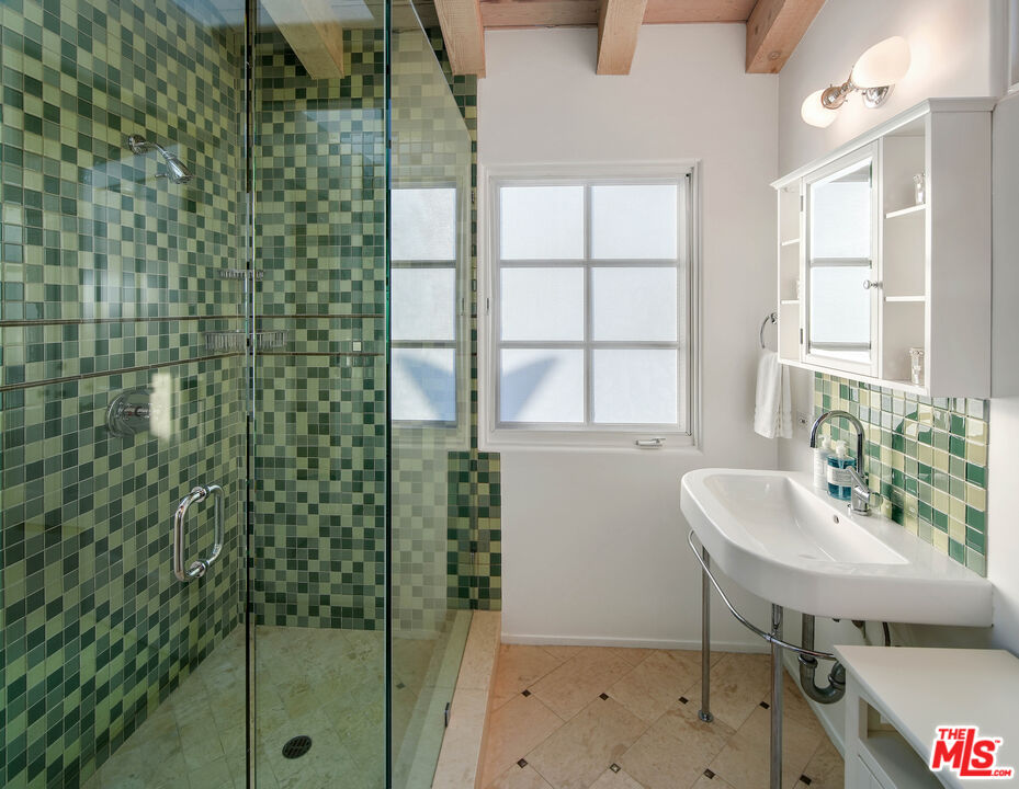 23422 Malibu Colony Road, Unit 98 Malibu, CA 90265 - Photo 36 of 53 a bathroom with a sink and a mirror