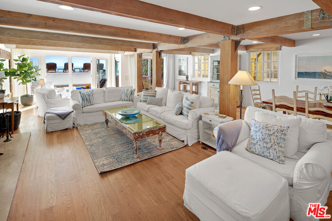 23422 Malibu Colony Road, Unit 98 Malibu, CA 90265 - Photo 4 of 53 a living room with furniture and a large window