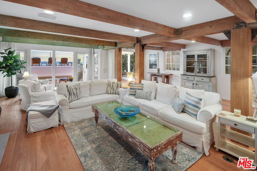 23422 Malibu Colony Road, Unit 98 Malibu, CA 90265 - Photo 5 of 53 a living room with furniture and a large window