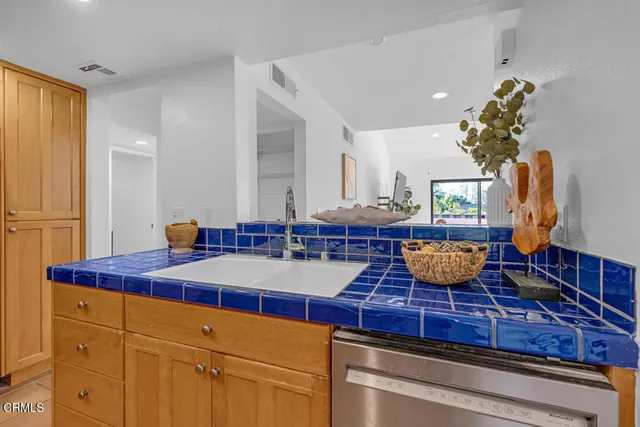 a room with table chairs and wooden floor