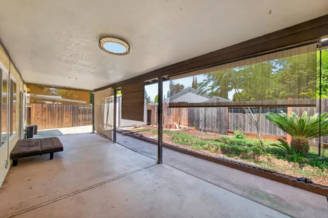a view of balcony with wooden floor and stairs