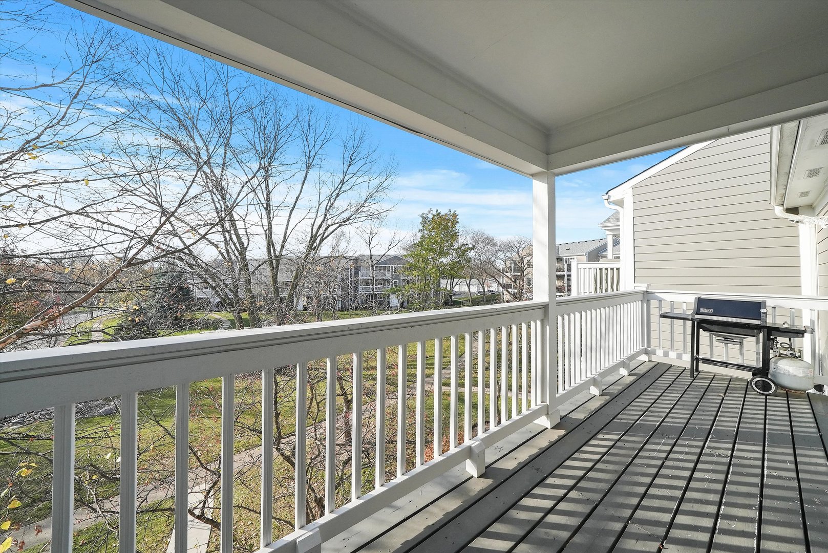 152 East Winchester Road, Unit E Libertyville, IL 60048 - Photo 18 of 24 a view of a balcony with furniture