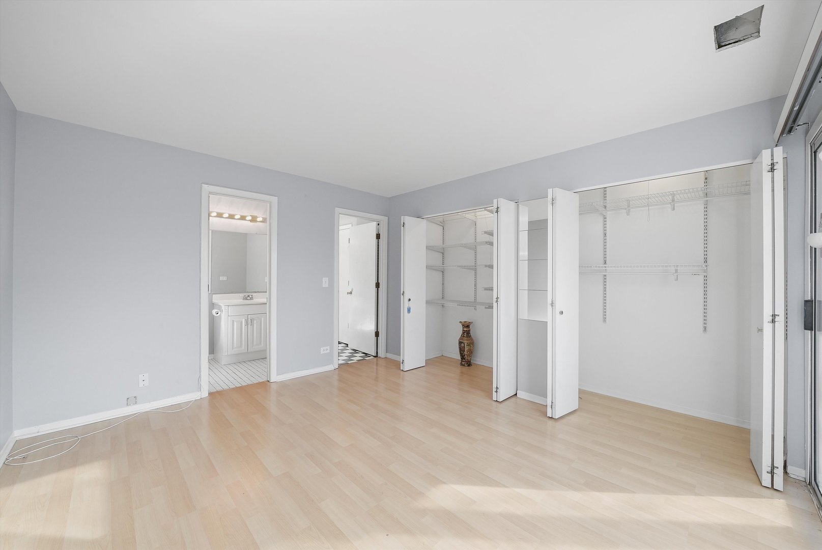 152 East Winchester Road, Unit E Libertyville, IL 60048 - Photo 22 of 24 a view of empty room with wooden floor