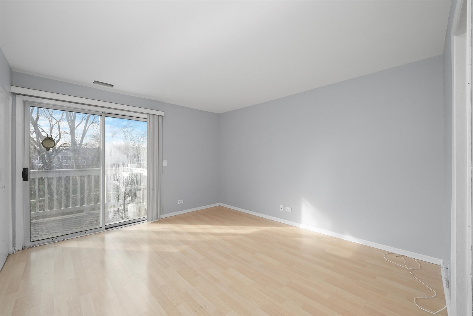 152 East Winchester Road, Unit E Libertyville, IL 60048 - Photo 23 of 24 a view of an empty room with a window