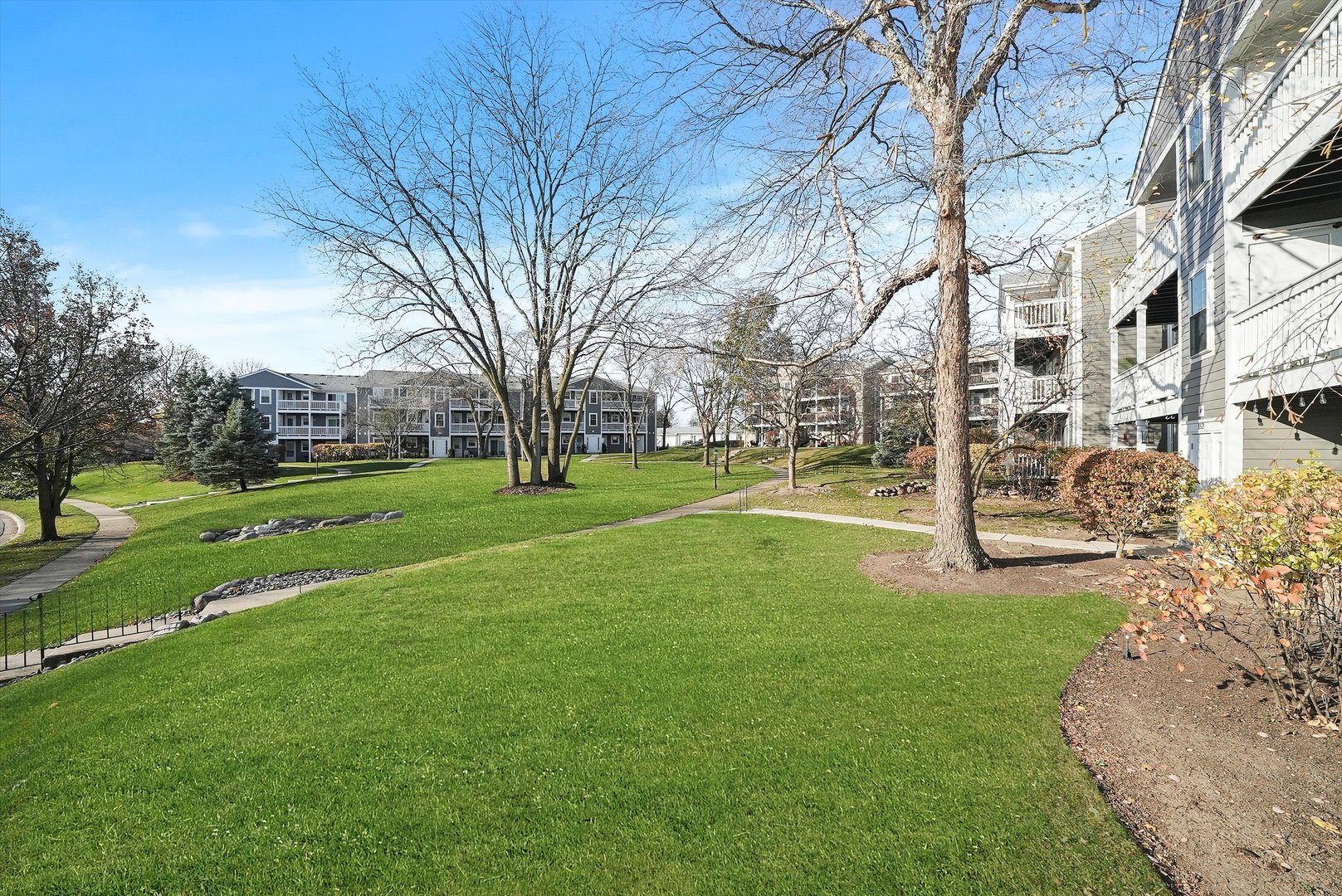 152 East Winchester Road, Unit E Libertyville, IL 60048 - Photo 5 of 24 a view of a park with large trees
