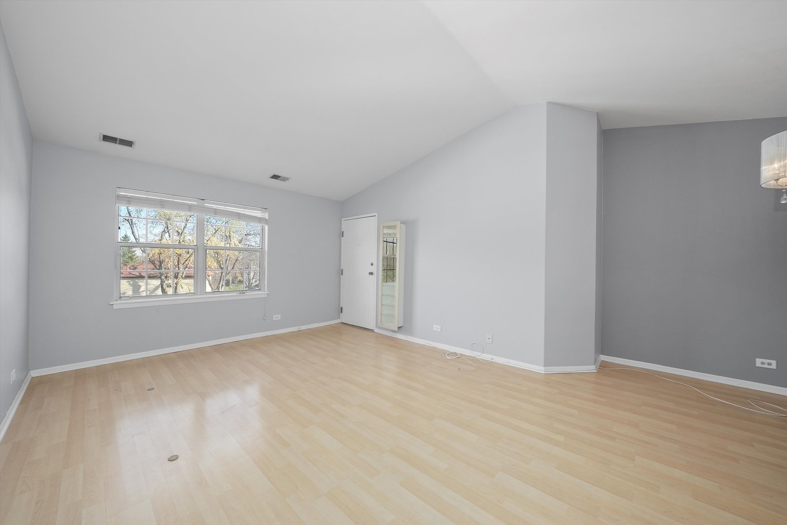 152 East Winchester Road, Unit E Libertyville, IL 60048 - Photo 8 of 24 a view of an empty room with a window
