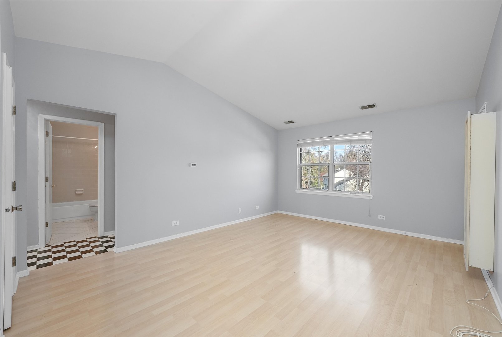 152 East Winchester Road, Unit E Libertyville, IL 60048 - Photo 10 of 24 an empty room with windows
