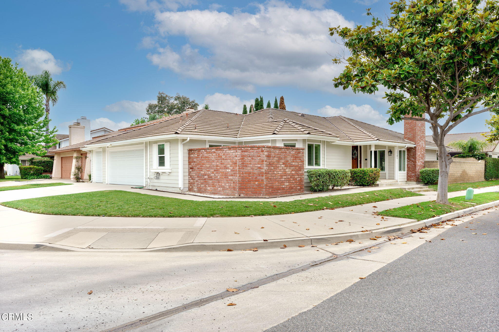 2281 Southern Hill Drive Oxnard, CA 93036 - Photo 2 of 29 a front view of a house with a yard and garage