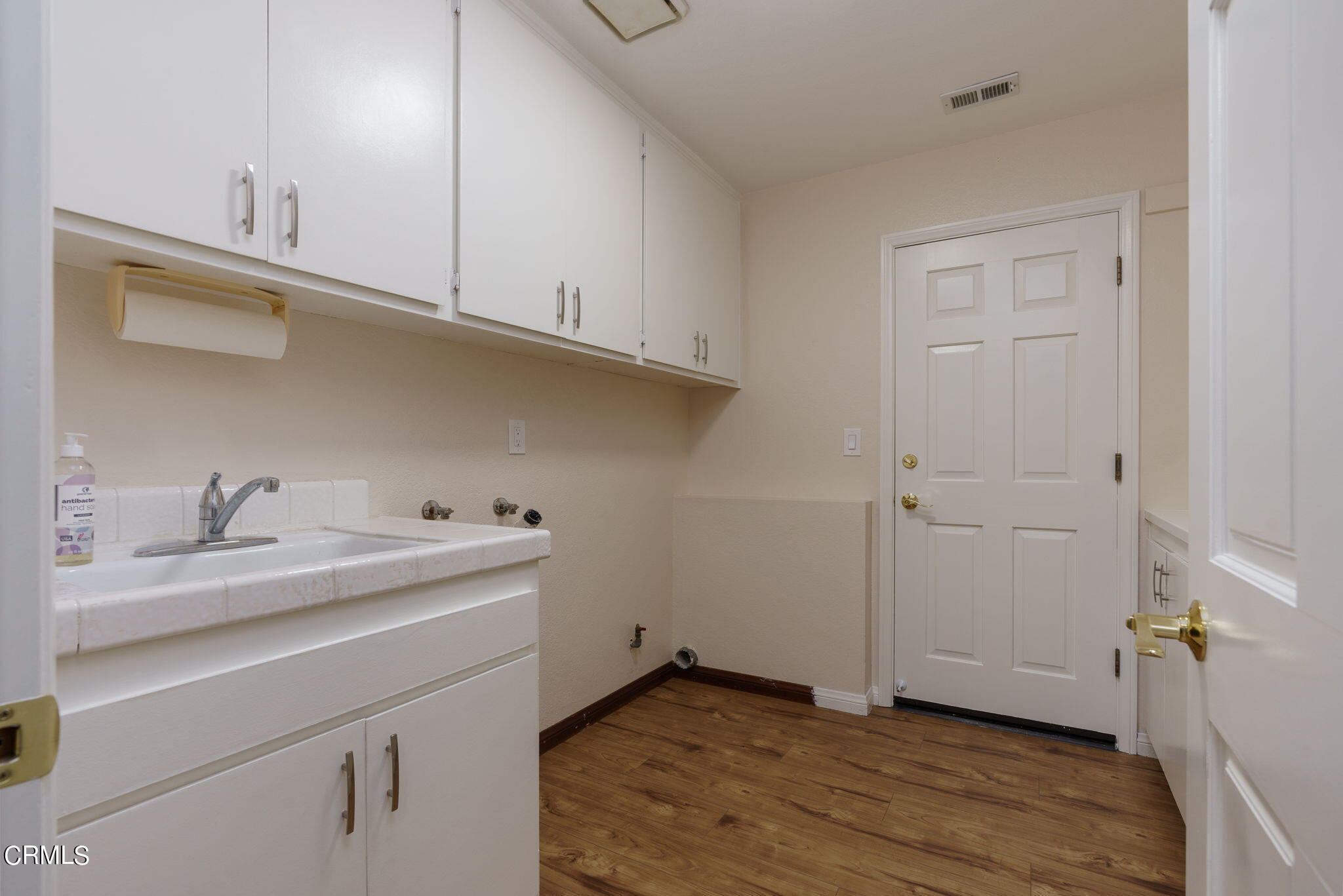 2281 Southern Hill Drive Oxnard, CA 93036 - Photo 23 of 29 a room with a sink cabinets and utility room