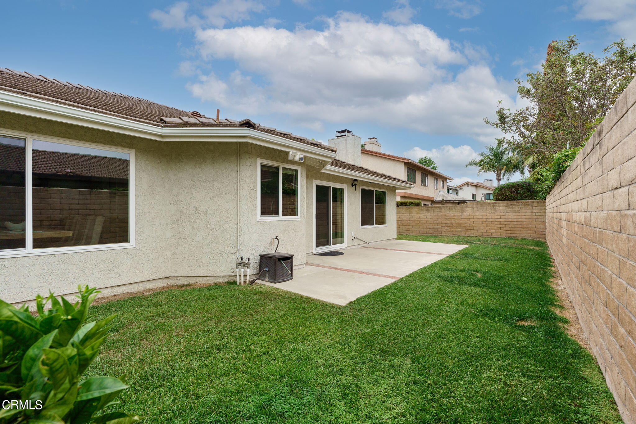 2281 Southern Hill Drive Oxnard, CA 93036 - Photo 24 of 29 a front view of a house with a garden and yard