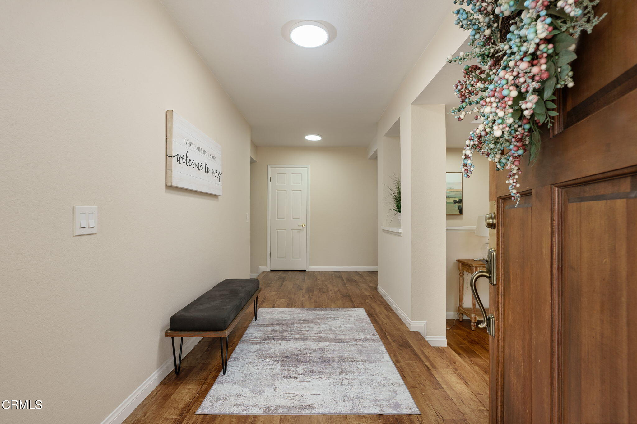 2281 Southern Hill Drive Oxnard, CA 93036 - Photo 4 of 29 a view of a hallway with wooden floor and a bathroom