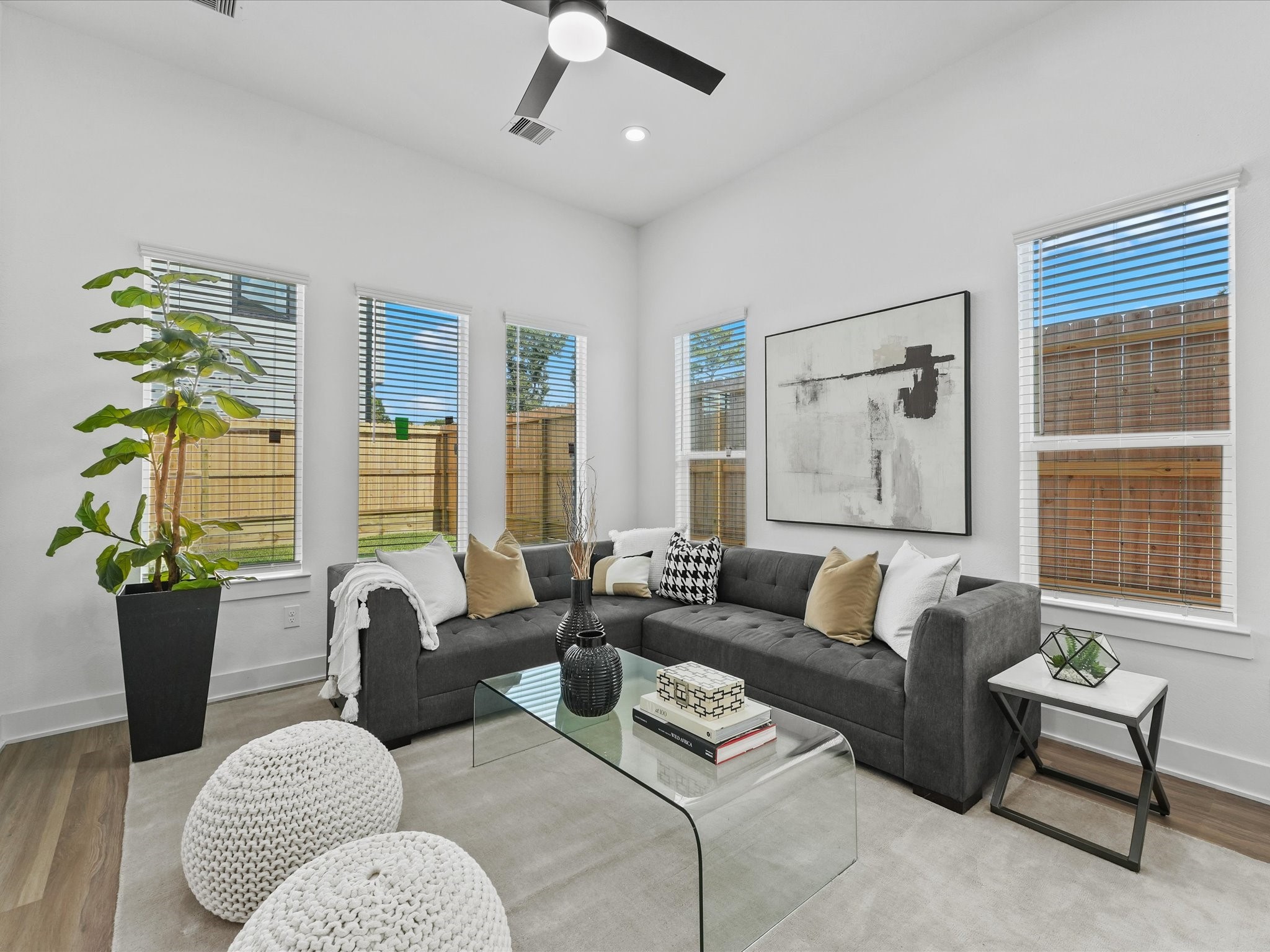 2592 West Tidwell Road Houston, TX 77091 - Photo 6 of 23 a living room with furniture and a potted plant