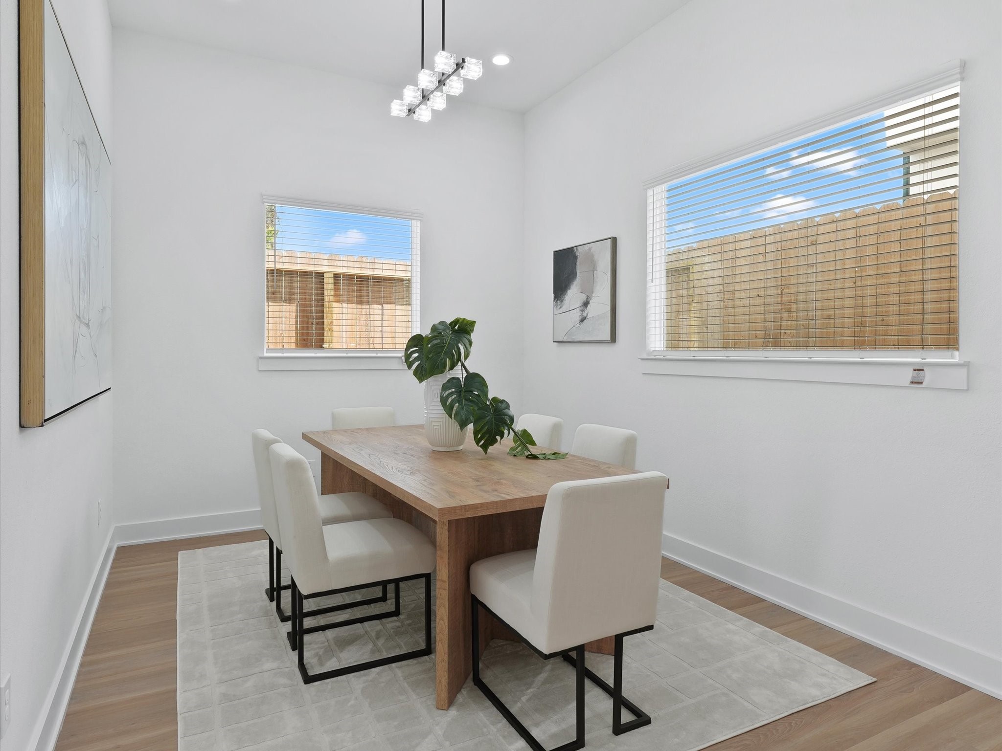 2592 West Tidwell Road Houston, TX 77091 - Photo 9 of 23 a view of a dining room with furniture and wooden floor