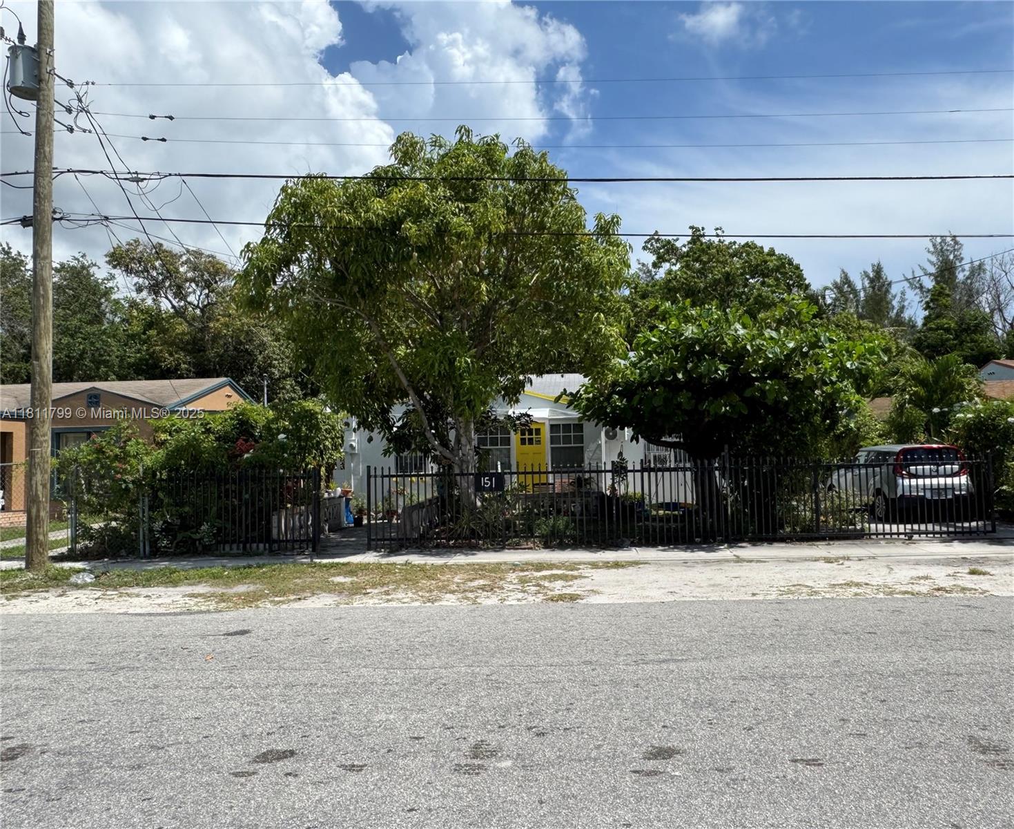 151 Northwest 64th Street Miami, FL 33150 - Photo 1 of 13 a view of a house with a snow in the yard