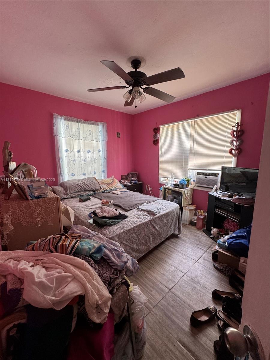 151 Northwest 64th Street Miami, FL 33150 - Photo 12 of 13 a view of a workspace with furniture and a window