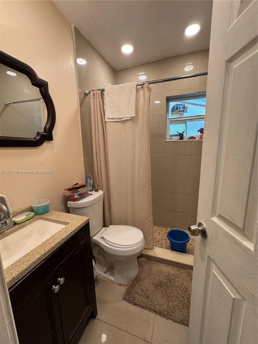 151 Northwest 64th Street Miami, FL 33150 - Photo 13 of 13 a bathroom with a sink toilet and mirror