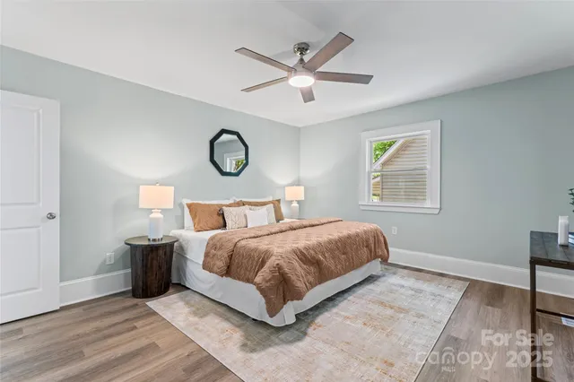 a bedroom with a large bed and a window