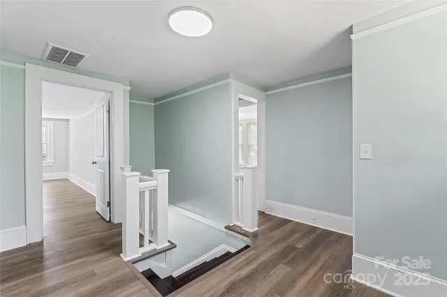 a view of front door with wooden floor