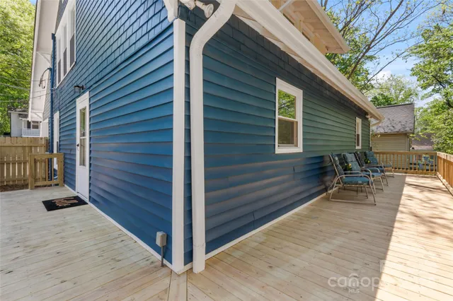 a backyard of a house with seating space
