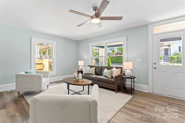 a living room with furniture and a window
