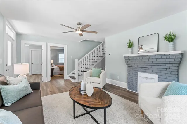 a living room with furniture and a fireplace