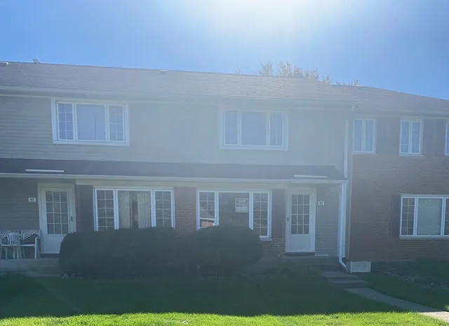 a view of house with backyard