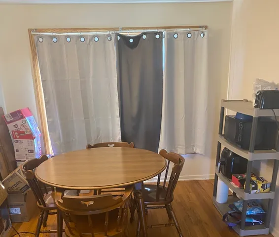 a view of a dining room with furniture and a fireplace