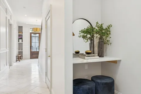 a bathroom with a shower sink and mirror
