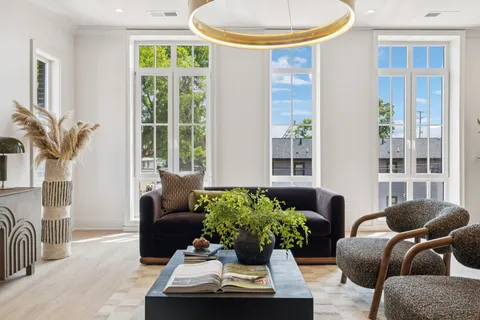 a kitchen with stainless steel appliances white cabinets and a counter top space