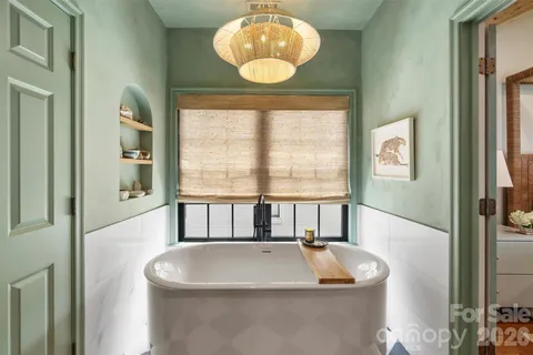 a bathroom with a sink and a window