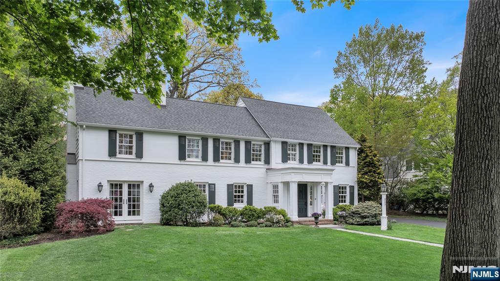 227 Fairmount Road Ridgewood, NJ 07450 - Photo 1 of 50 a front view of a house with a garden and plants