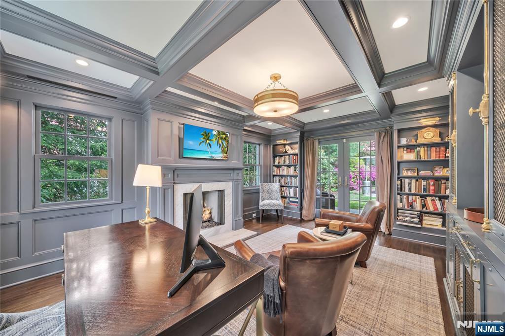 227 Fairmount Road Ridgewood, NJ 07450 - Photo 11 of 50 a view of a dining room with furniture a chandelier and wooden floor