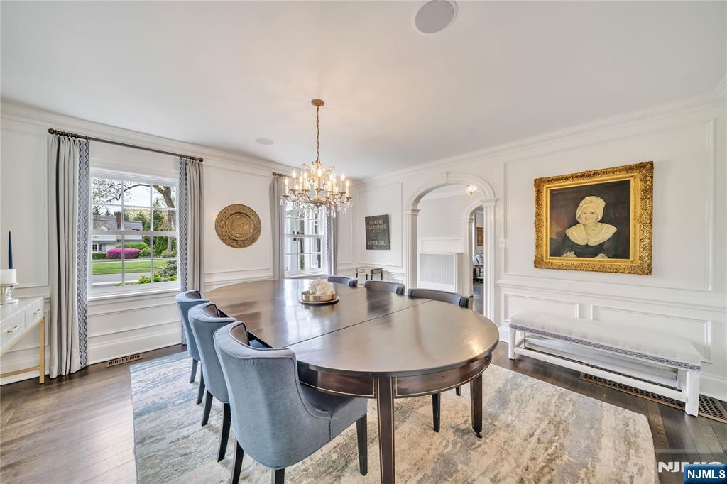 227 Fairmount Road Ridgewood, NJ 07450 - Photo 14 of 50 a dining room with furniture a chandelier and wooden floor