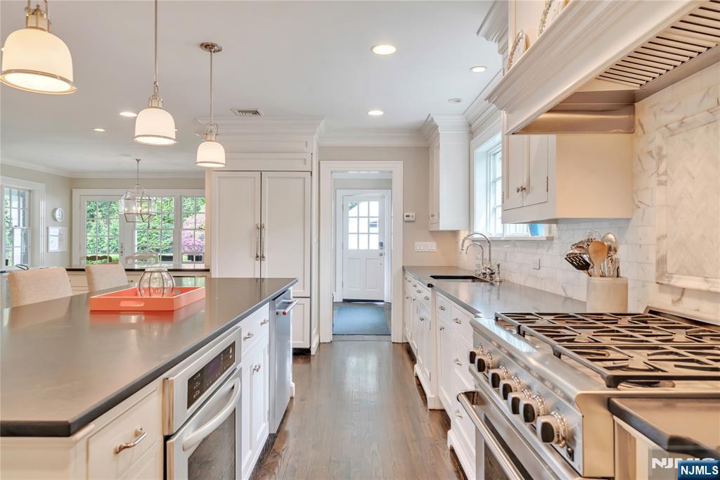 227 Fairmount Road Ridgewood, NJ 07450 - Photo 19 of 50 a kitchen with stainless steel appliances granite countertop a stove and a sink