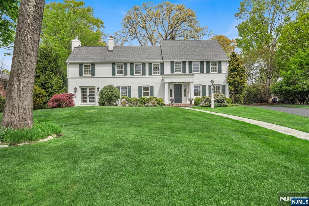 227 Fairmount Road Ridgewood, NJ 07450 - Photo 2 of 50 a front view of a house with a garden