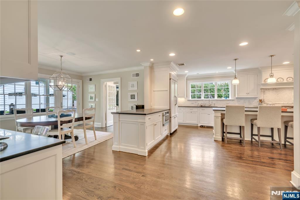 227 Fairmount Road Ridgewood, NJ 07450 - Photo 23 of 50 a large open kitchen with a large window and stainless steel appliances