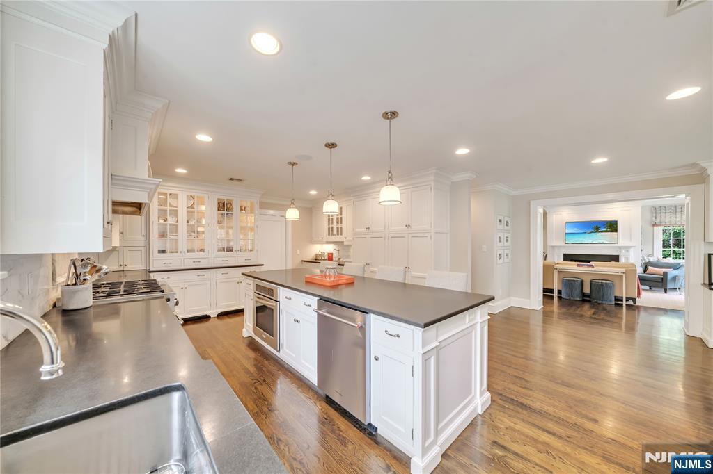 227 Fairmount Road Ridgewood, NJ 07450 - Photo 24 of 50 a kitchen with stainless steel appliances granite countertop a sink and stove